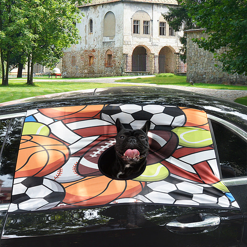 Style C (sports-ball print) installed at the front windshield; a French bulldog hangs its head out the central opening, tongue out, feeling the breeze